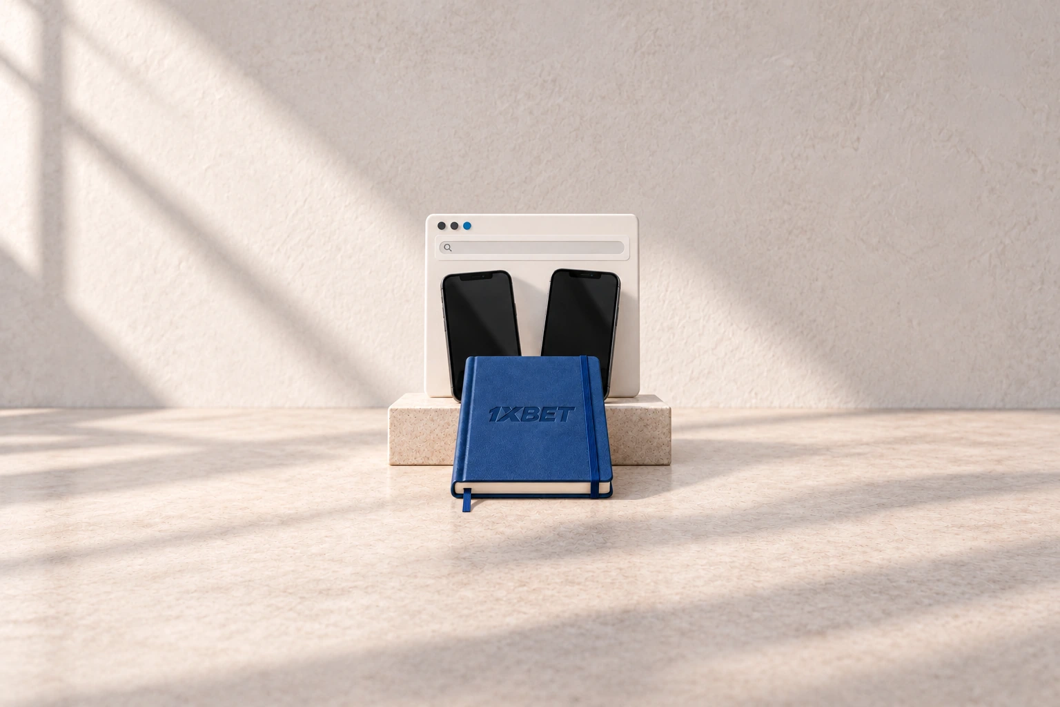 Deux téléphones et un cadre de navigateur entourent un carnet bleu 1XBET sur une table de travail.